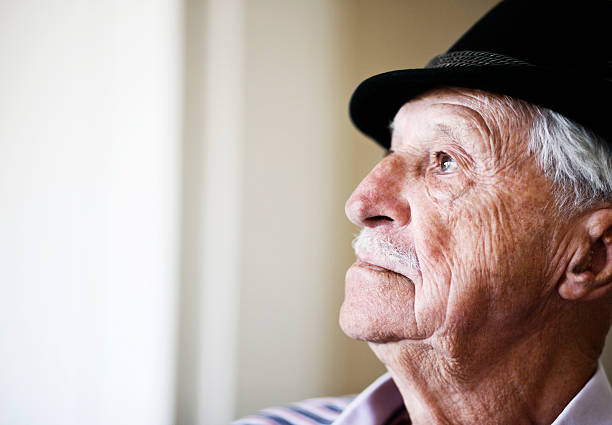istock Profile portrait of serious 80 year old man in hat 186873183