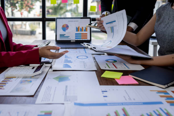 istock Team Of Business working at the office with documents on desk, planning analyzing the financial report, business plan investment, Consultant, finance analysis concept 1868740951