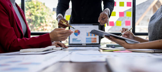 istock Team Of Business working at the office with documents on desk, planning analyzing the financial report, business plan investment, Consultant, finance analysis concept 1868740966