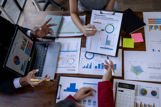 istock Team Of Business working at the office with documents on desk, planning analyzing the financial report, business plan investment, Consultant, finance analysis concept 1868740970
