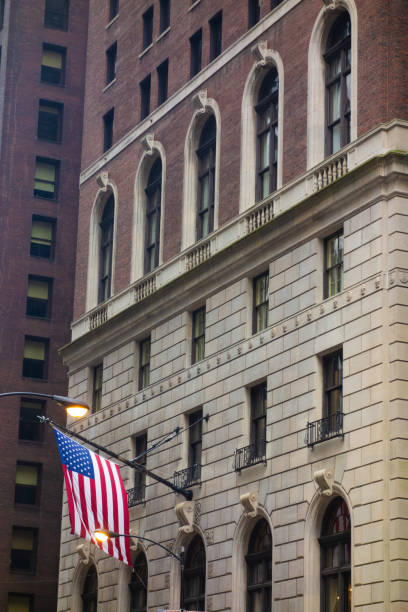 istock American flag hanging on a building 1868741493