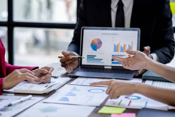 istock Team Of Business working at the office with documents on desk, planning analyzing the financial report, business plan investment, Consultant, finance analysis concept 1868741540