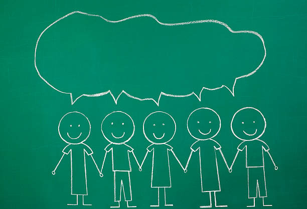 Chalkdrawing of group of stick figures with a large jointly shared speech bubble above them.