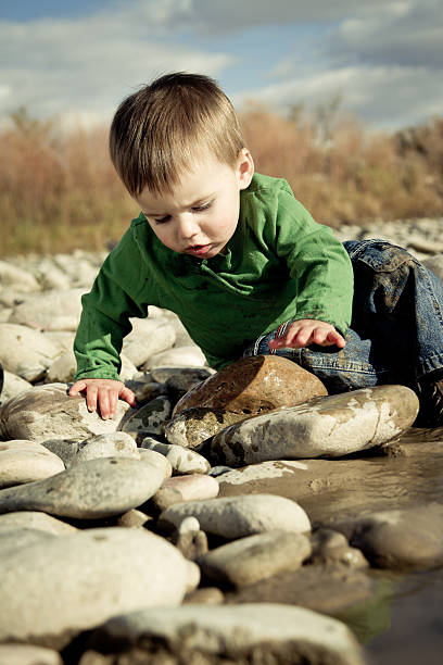 istock Toddler Boy Splashing in a pond 186874302