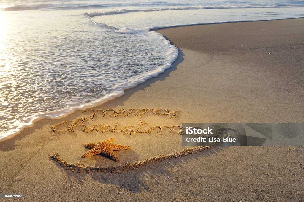 Buon Natale messaggio nella sabbia - Foto stock royalty-free di Natale