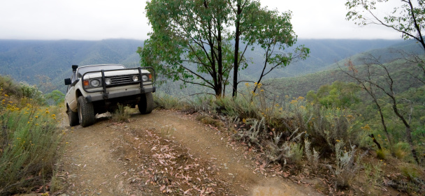 A four wheel drive tackling the Wombat Spur Track in the Victorian Alps.  This area of the Victorian High Country provides some of the most challenging off-road driving in Australia.