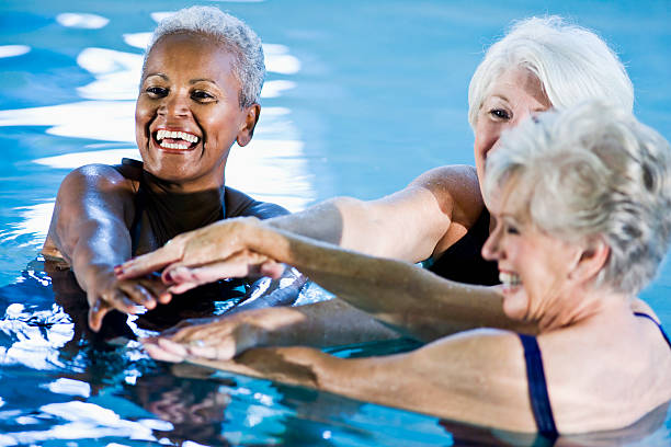 istock Multiracial senior women in water aerobics class 186875719