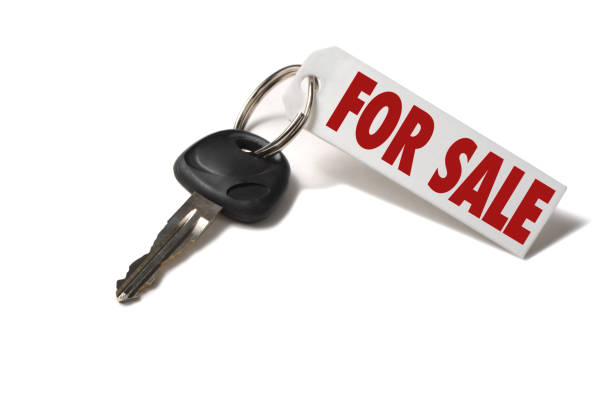 Car Key with For Sale Tag Isolated on White Background Car Key with For Sale Tag Isolated on White Background car for sale stock pictures, royalty-free photos & images