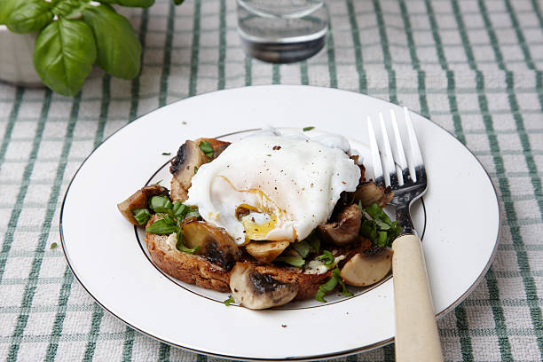 istock Poached egg over herby mushrooms on toast 186875842