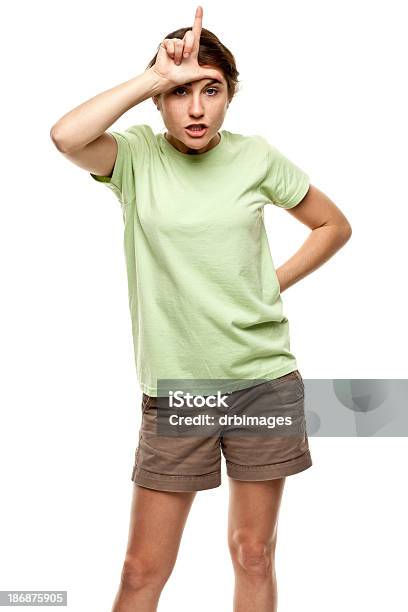 Female Portrait Stock Photo - Download Image Now - Hands Behind Back, Teasing, 20-24 Years