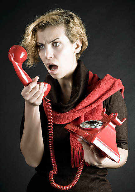 istock Young Woman shouting into telephone 186875966