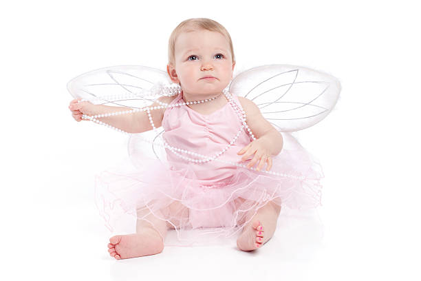 baby wearing pink tutu con alas sentada sobre fondo blanco - ballet dress studio shot costume fotografías e imágenes de stock