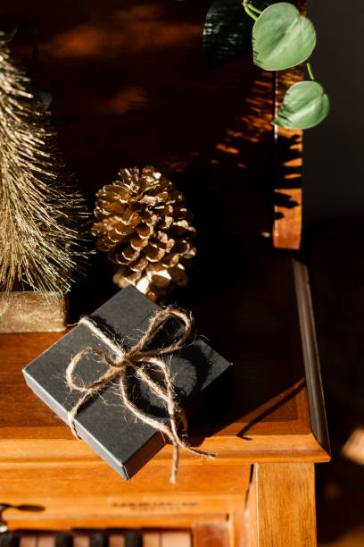 istock Small gift box on piano for Christmas holidays 1868767916