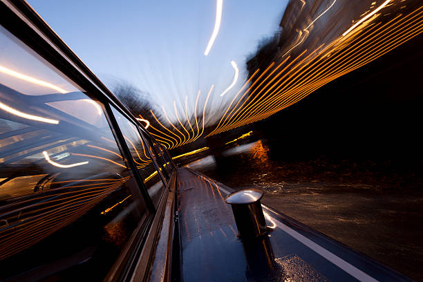 istock Evening canal cruise Amsterdam, long exposure light trails 186877000