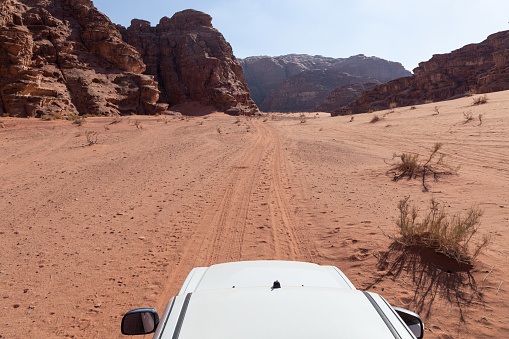 Off road vehicle exploring the desert of Wadi Rum, Jordan in Jordan, Aqaba Governorate, Aqaba