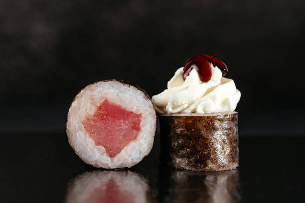istock classic Japanese sushi rolls on a dark background with reflectio 1868782043