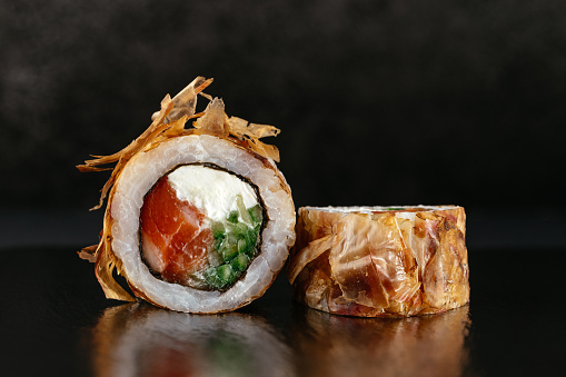 classic Japanese sushi rolls on a dark background with reflectio in Tokyo, Tokyo, Japan