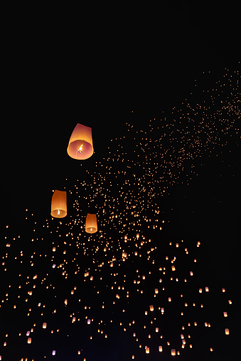 Tourist floating sky lanterns in Yi-Peng (Loy Krathong) festival , Chiang Mai ,Thailand.