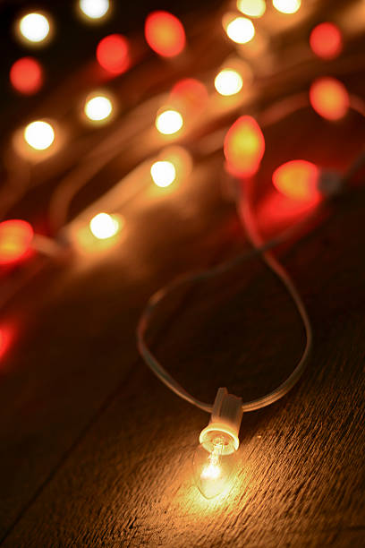 istock Christmas Lights on wood floor 186878656