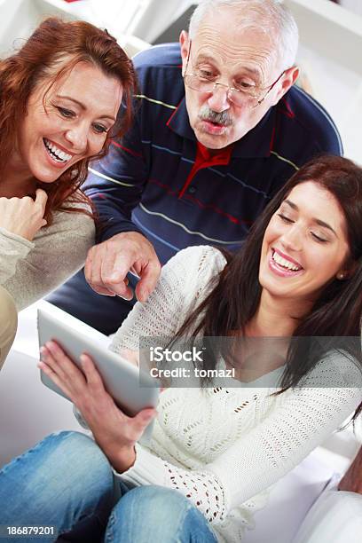 Family Wathcing Photos Stock Photo - Download Image Now - Cheerful, Computer, Digital Tablet