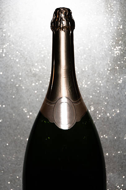 Champagne bottle close-up with glitter background