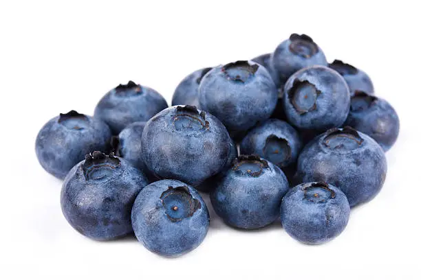 Pile of fresh blueberries on white