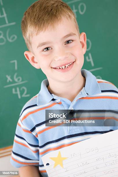 Proud Student Holding Paper With Star Stock Photo - Download Image Now - 6-7 Years, 8-9 Years, Achievement