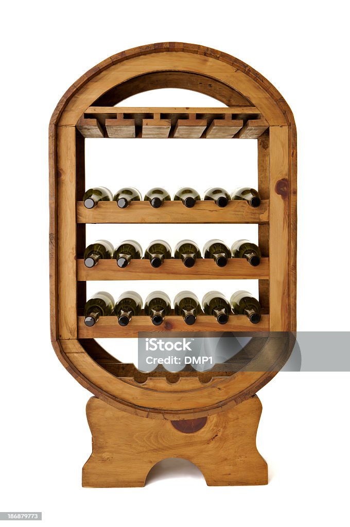 Wine bottles in large freestanding wooden rack on white background White wine bottles in a wooden wine rack. One of a series. White background. Wine Rack Stock Photo