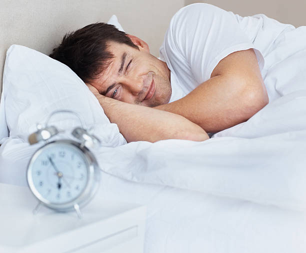 istock Irritated man woken up in the morning 186879868