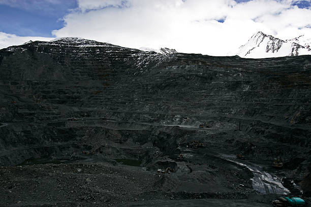istock Large trucks at mountin gold mine 186880751