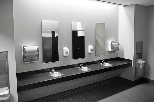 Restroom Sinks A public restroom's sinks. soap dispenser stock pictures, royalty-free photos & images