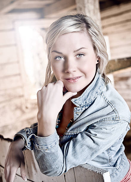 istock casual woman in a barn 186880836
