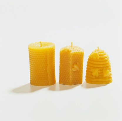 Bees wax candles on white background