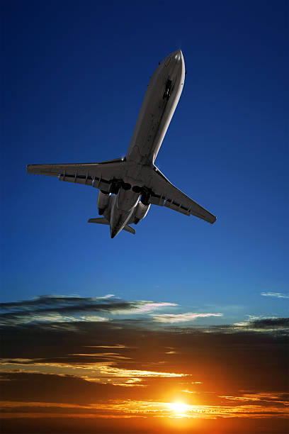 istock corporate jet airplane landing at sunset 186881035