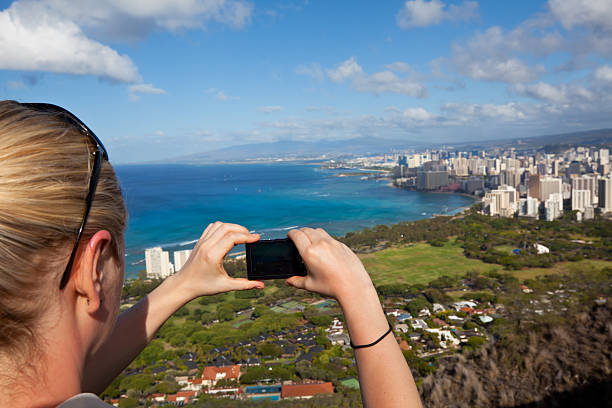istock Tourist admiring Honolulu skyline 186881471