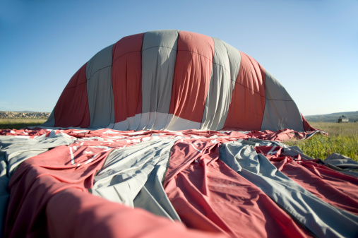 Deflation of a hot air balloon.