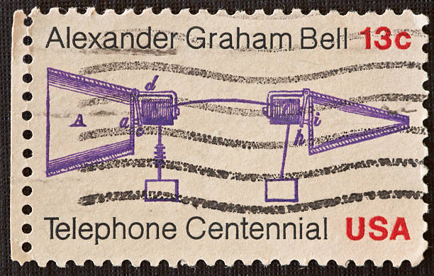 Telephone Centennial Postage Stamp "On March 10, 1976, the Postal Service issued a 13-cent Telephone Centennial stamp to honor the 100th anniversary of Alexander Graham Bell's invention of the telephone. The stamp  design is based on Bell's original sketch of the first telephone." alexander graham bell stock pictures, royalty-free photos & images