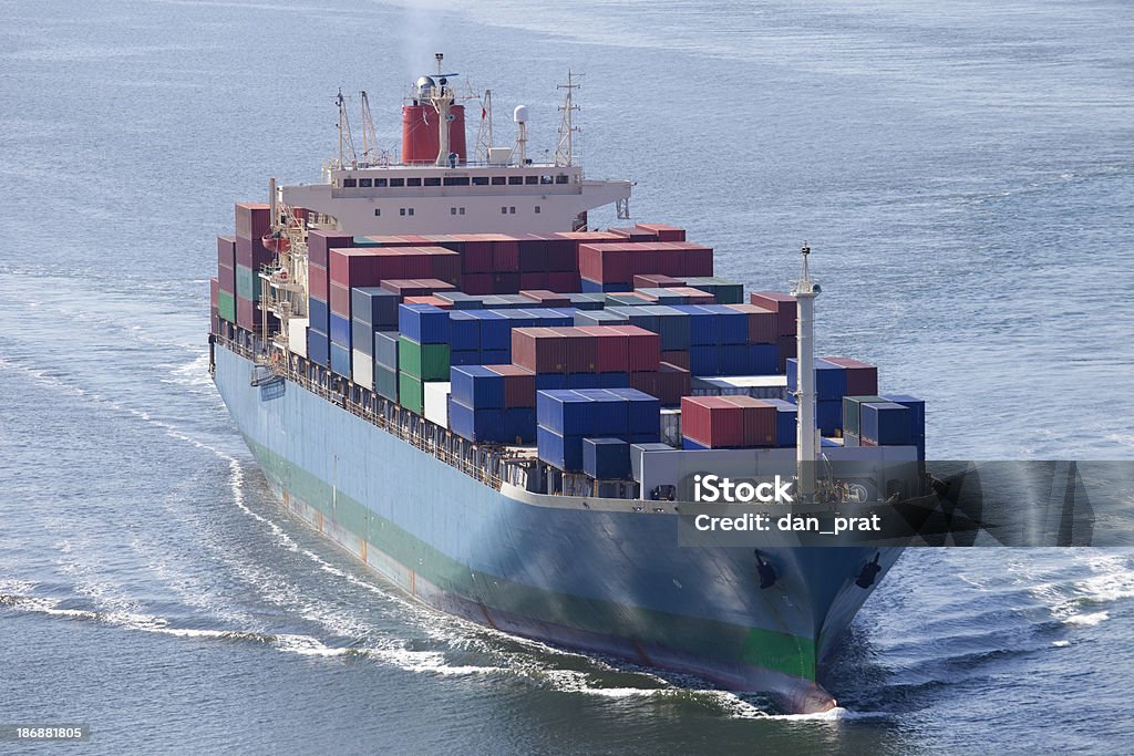 Container Ship A large loaded container ship sailing into port. Aerial View Stock Photo