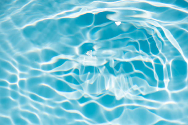 istock Defocus blurred transparent blue colored clear calm water surface texture with splashes and bubbles. Trendy abstract nature background. Water waves in sunlight with copy space. Blue watercolor shining 1868818673