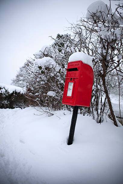 istock Red Letterbox in Winter Snow 186882836