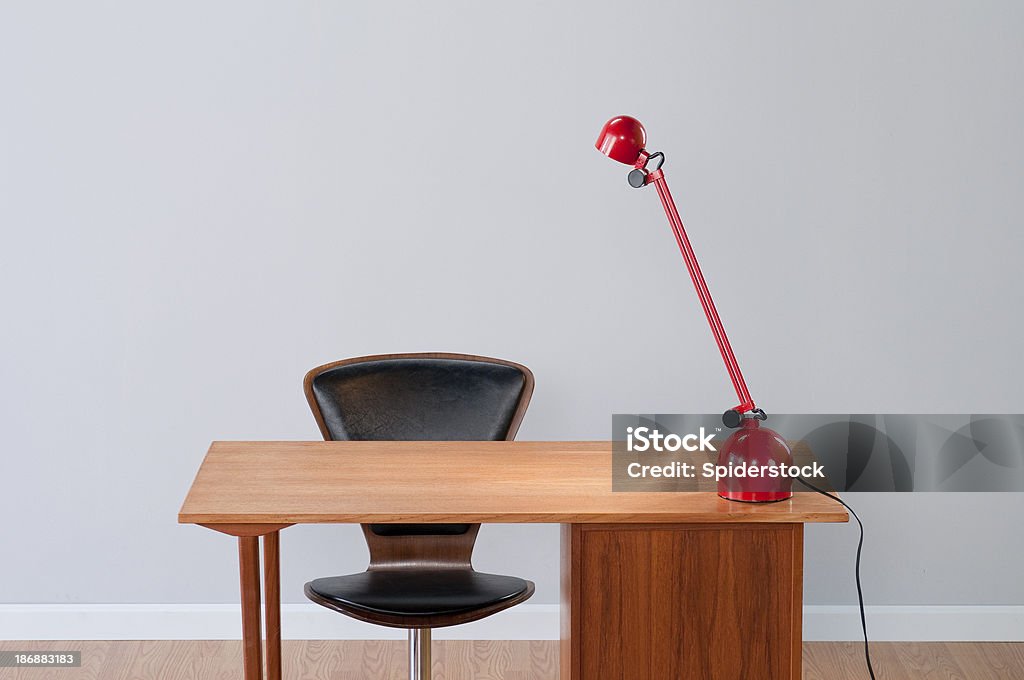 Stylish Home Office "Stylish home office with danish mid-century modern desk, red modern lamp and leather chrome office chair.Take a look at my other related lightboxes." Mid-Century Style Stock Photo