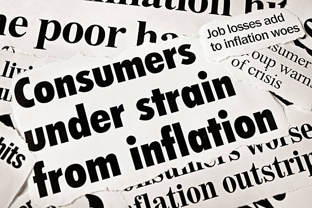 istock Press headlines stating "consumers under strain from inflation" 186883225