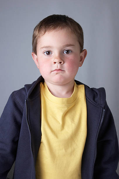 istock Four year old boy hoodie curious look 186883367
