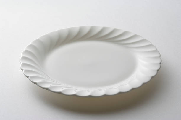 istock Isolated shot of empty white plate on white background 186883465