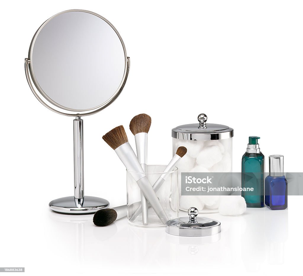 Selection of cosmetic items on white background A group of generic beauty products on a white background with a reflection. Cotton Ball Stock Photo