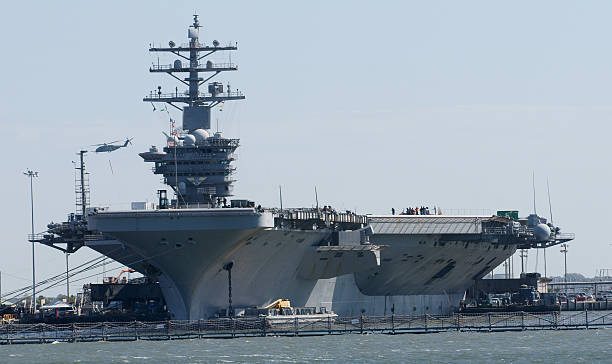 us navy aircraft carrier - flugzeugträger stock-fotos und bilder