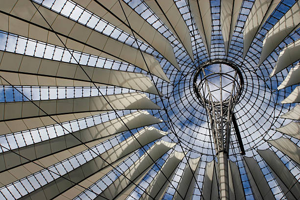 Berlin, Germany - June 29, 2022: The Sony Center at the Potsdamer Platz. The glass roof with sun sails hanging from steel cables. The vaulted roof covering the central open area of complex