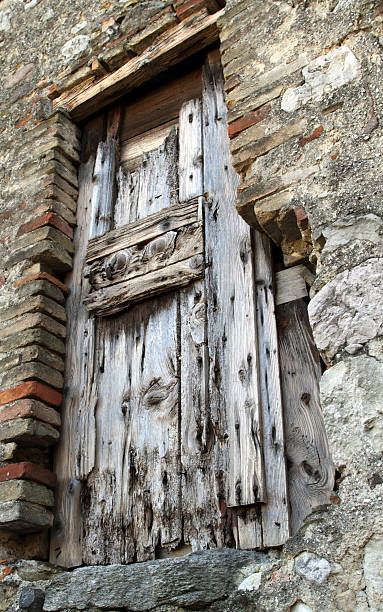 istock Very old damaged wooden door 186883989