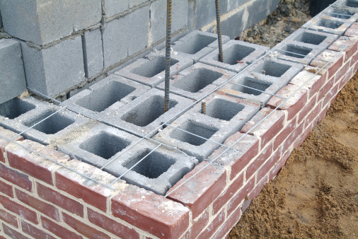 A block and brick wall under construction.