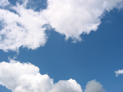 Image of a blue sky and white puffy clouds